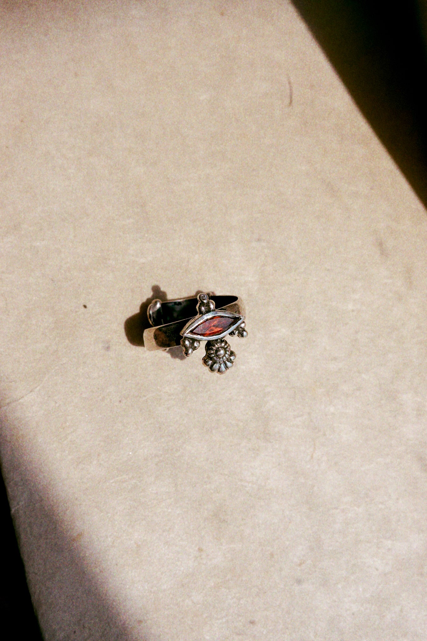 N182 - Akhe Silver Ring With Faceted Red Garnet